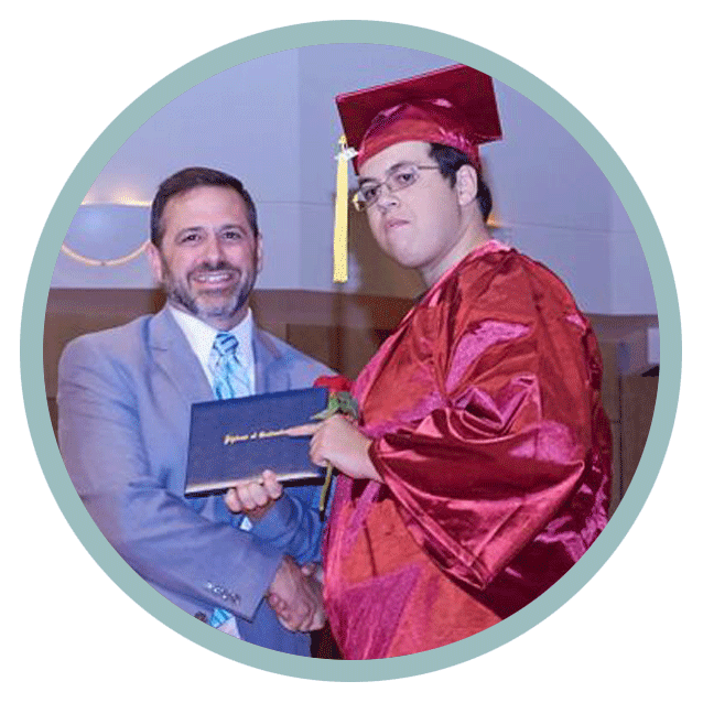 Adam Madjour posing with diploma